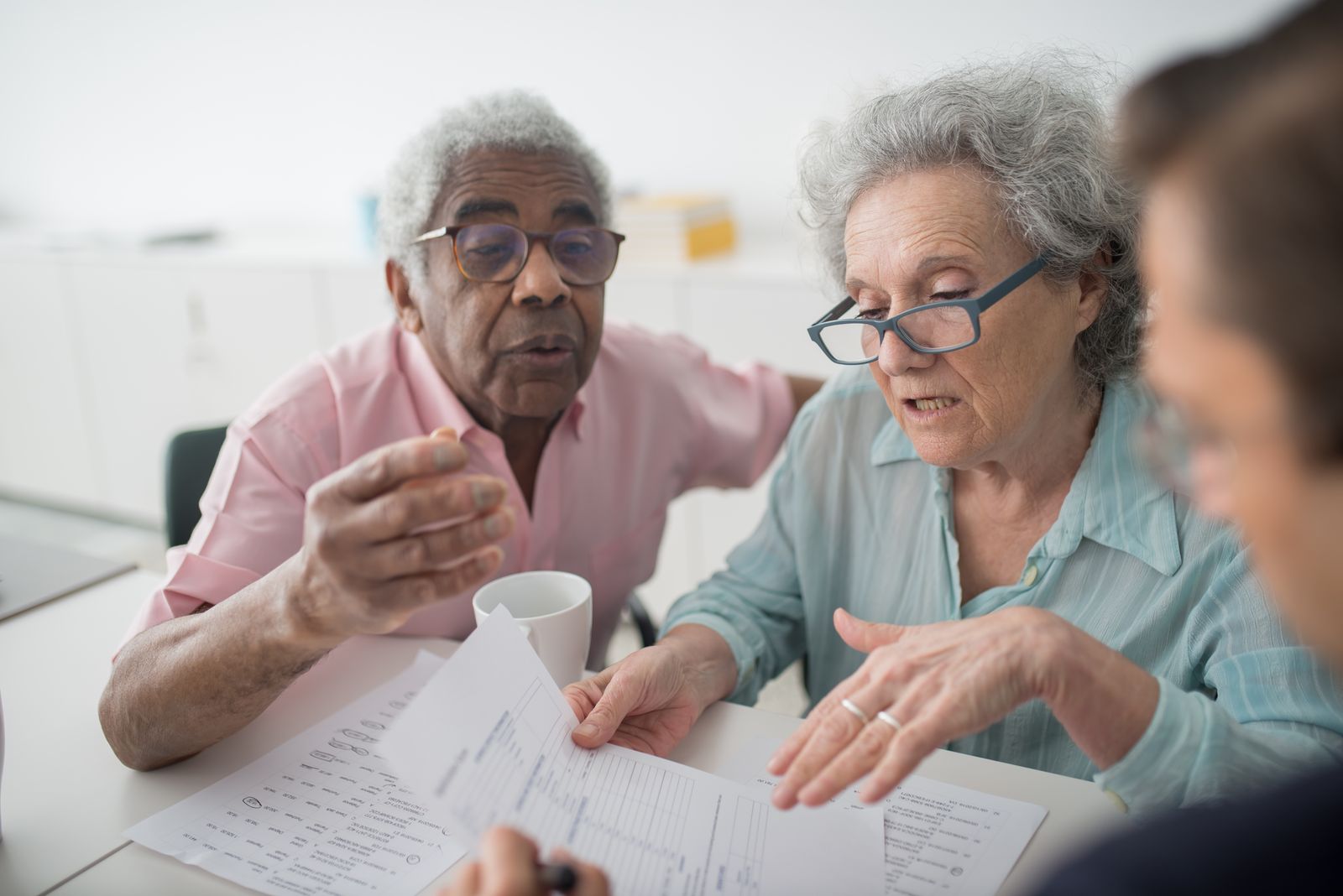 Sagebrook advisor meeting with Medicare clients at a table