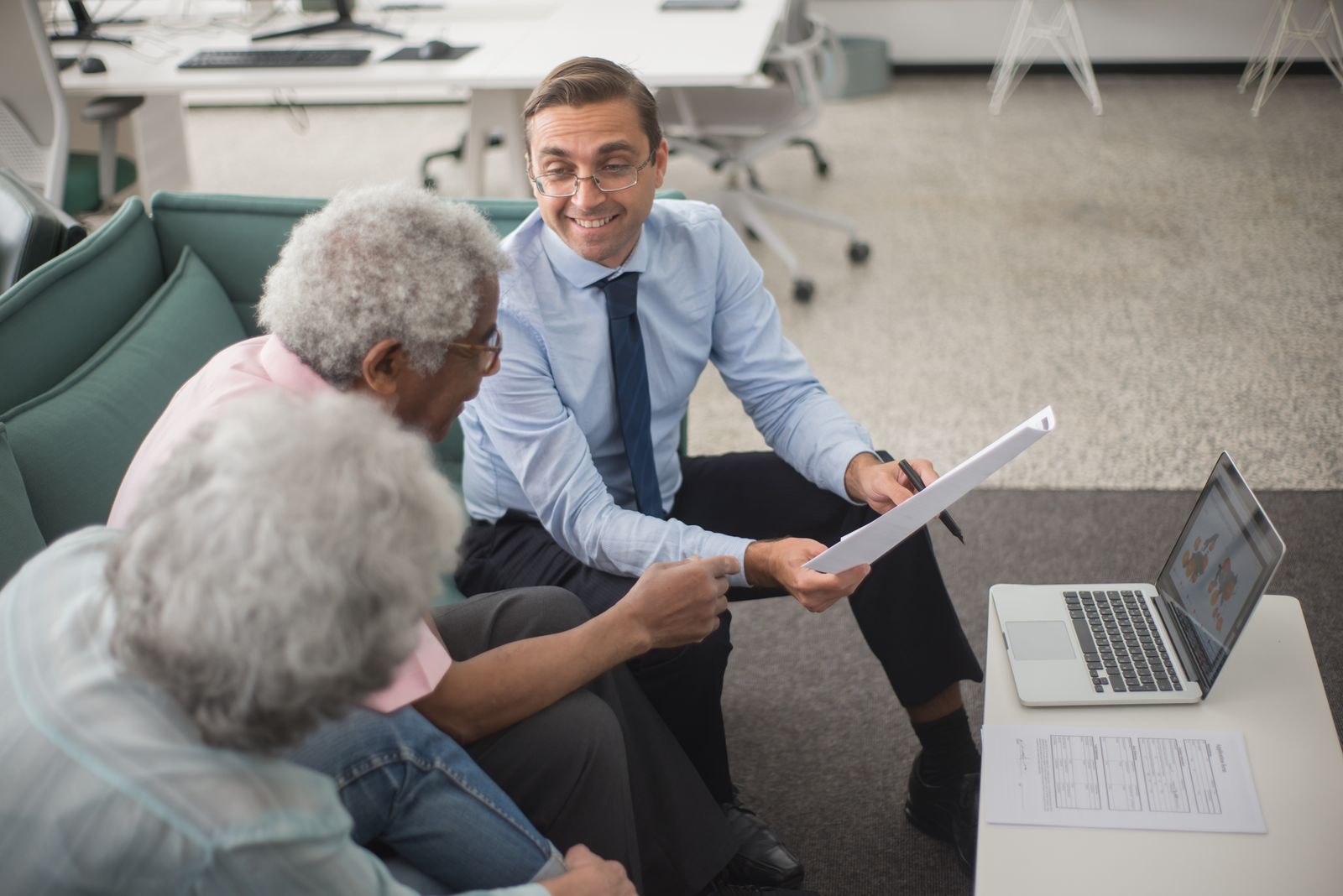 Sagebrook advisor meeting with Medicare clients at a table