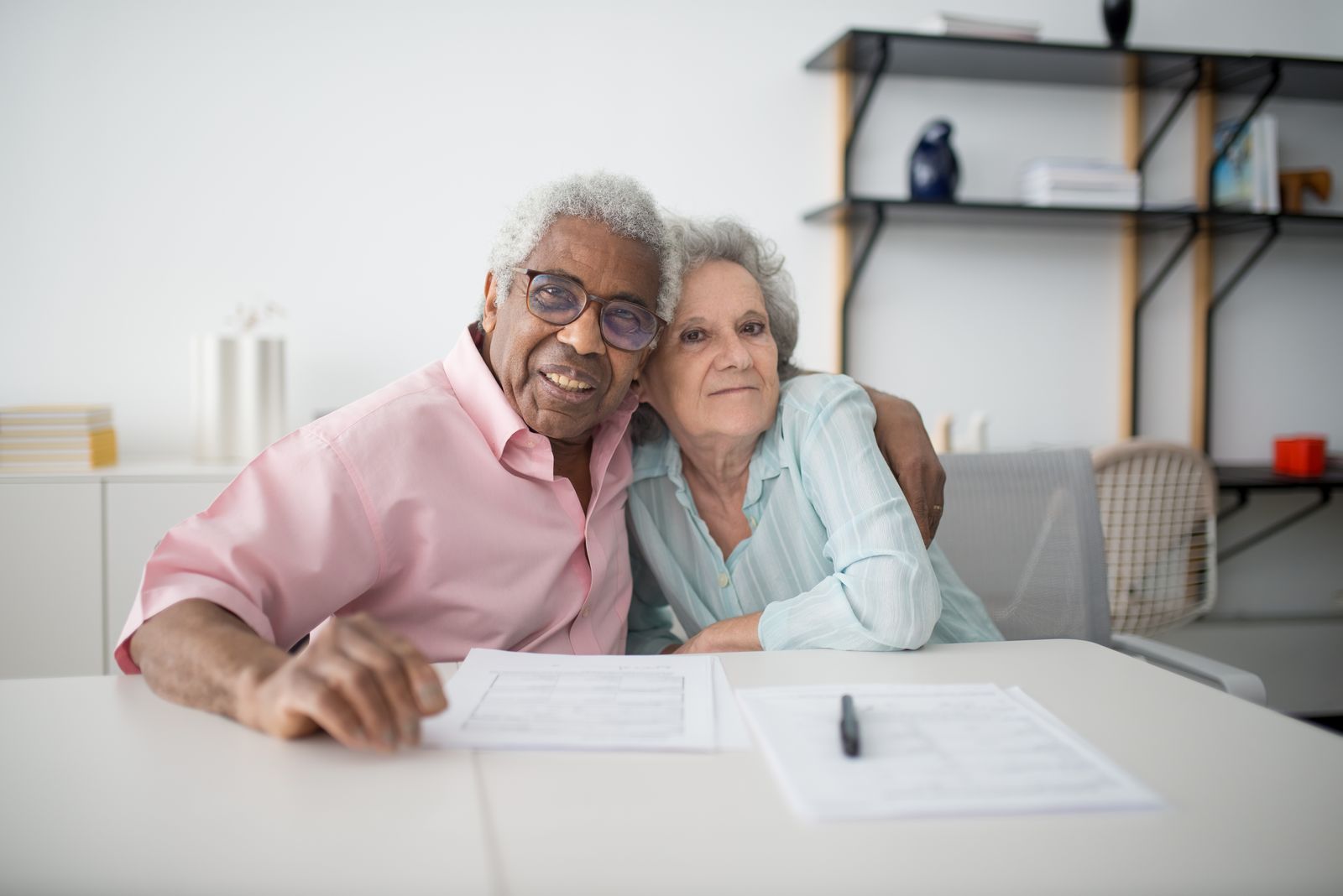 Couple checking a creditable coverage letter from an employer together at home